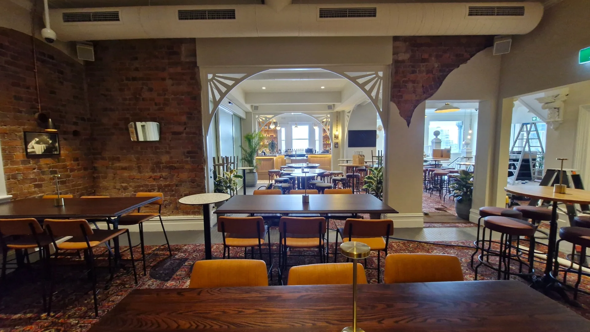 Layered lighting across the Palace Hotel dining and bar spaces.