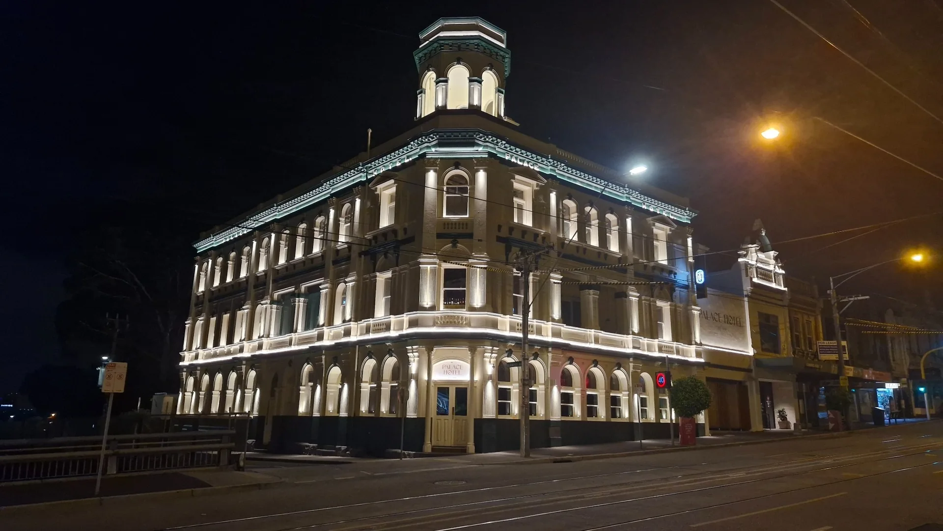 Illuminated heritage façade of the Palace Hotel in Camberwell