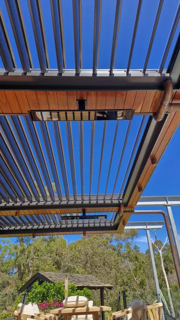 Pixie-controlled patio heaters in the outdoor entertaining area.