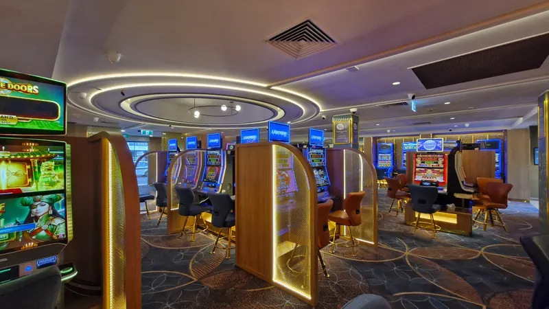 Illuminated gaming partitions and ceiling lighting at the Rosstown Hotel.
